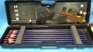 A CASE CONTAINING CROSSBOW ARROWS AND ACCESSORIES