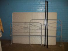 A CAST IRON DOUBLE BED FRAME