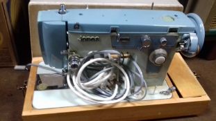 A JONES CASED SEWING MACHINE