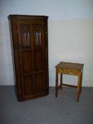 AN OAK WARDROBE AND A VINTAGE SCHOOL DESK.