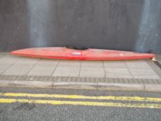 A SINGLE MAN CANOE WITH A DOUBLE ENDED OAR