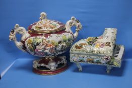 A CAPO DE MONTE STYLE TWIN-HANDLED LIDDED BOWL, TOGETHER WITH A CAPO DE MONTE 'CONCERTO' PIANO