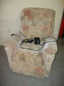 A FABRIC LAZYBOY RISE AND RECLINE CHAIR.