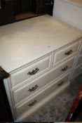 A MODERN CREAM 4 DRAWER CHEST