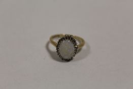 A LADIES 9 CARAT GOLD OPAL AND DIAMOND DRESS RING