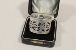 A BOXED PIERCED HALLMARKED SILVER NAPKIN RING