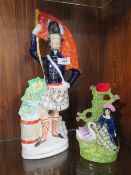 A LARGE STAFFORDSHIRE STYLE FLATBACK FIGURE TOGETHER WITH A SIMILAR VASE (2)