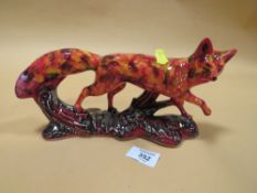 A SIGNED ANITA HARRIS ART POTTERY RUNNING FOX FIGURE