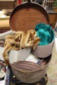 A LARGE TIN HAT BOX CONTAINING ASSORTED HATS, STOLE ETC