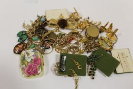A BOX OF YELLOW METAL COSTUME JEWELLERY ETC.