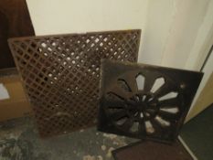 TWO CAST IRON GRATES TOGETHER WITH ANOTHER 93)