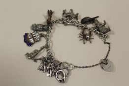 A HALLMARKED SILVER CHARM BRACELET