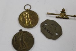 TWO WWI MEDALS, TOGETHER WITH A DOG TAG AND A MILITARY BROOCH