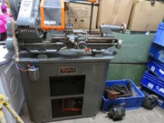 A MYFORD SUPER 7 METALWORKING LATHE ON CABINET, with single phase motor, one x four jaw chuck and