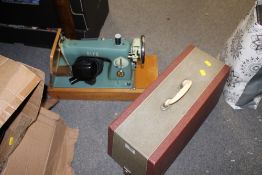 A CASED VINTAGE ALPHA SEWING MACHINE