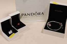 A BOXED PANDORA CHARM BRACELET WITH TWO ADDITIONAL BOXED CHARMS