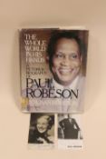 A SIGNED PHOTOGRAPH OF PAUL ROBESON, TOGETHER WITH ANOTHER AND HIS PICTORIAL BIOGRAPHY (3)