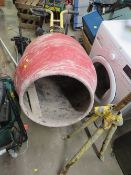 A RED CEMENT MIXER WITH ADDITIONAL STAND