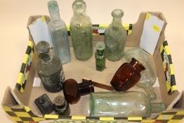 A TRAY OF VINTAGE GLASS BOTTLES
