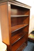 A MODERN OPEN MAHOGANY BOOKCASE
