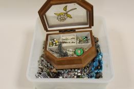 A TUB OF COSTUME JEWELLERY TO INCLUDE SILVER EXAMPLES, MARCASITE EAGLE BROOCH ETC.