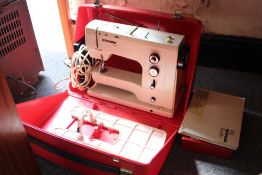 A CASED BERNINA RECORD SEWING MACHINE WITH INSTRUCTIONS