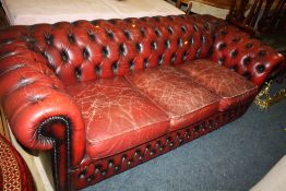 AN OXBLOOD RED LEATHER CHESTERFIELD SETTEE A/F