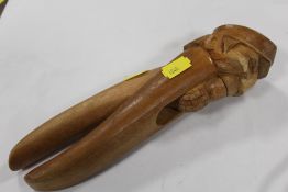 A PRISONER OF WAR STYLE CARVED WOODEN NUT CRACKER A/F