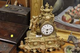 A FRENCH GILT METAL FIGURAL MANTEL CLOCK