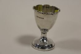 A HALLMARKED SILVER EGG CUP