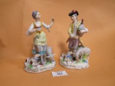 A PAIR OF VINTAGE CERAMIC FIGURES WITH CROSSED SWORD BACK STAMPS