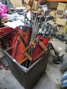 A WOODEN TEA CRATE CONTAINING A LARGE QUANTITY OF GOLF CLUBS ETC