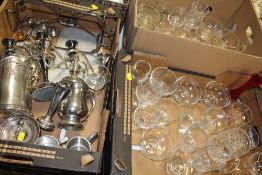 A TRAY OF SILVER PLATED METALWARE TO INCLUDE CANDELABRA, TOGETHER WITH TWO TRAYS OF GLASSWARE (3)