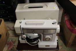 A VINTAGE CASED CROWN POINT SEWING MACHINE