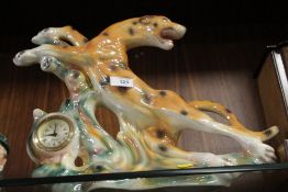 A MERCADES LUSTRE MANTEL CLOCK IN THE FORM OF A LEOPARD
