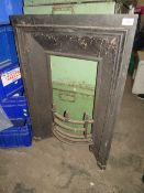 A CAST METAL ANTIQUE FIREPLACE