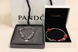 A PANDORA BANGLE, TOGETHER WITH A SIMILAR BRACELET (2)