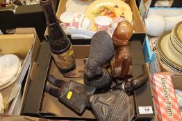 FIVE TRIBAL ART TREEN CARVINGS, TOGETHER WITH A NIGERIAN LEATHER COVERED BOTTLE