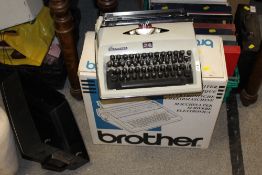 A BOXED BROTHER TYPEWRITER TOGETHER WITH A CONTESSA EXAMPLE