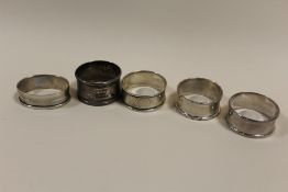 FIVE SILVER NAPKIN RINGS TO INCLUDE A CHARLES HORNER EXAMPLE