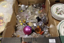 A TRAY OF EMPTY PERFUME BOTTLES