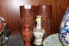 A PAIR OF ORIENTAL CARVED BAMBOO BRUSH POTS TOGETHER WITH A TWIN HANDLED WHITE METAL BASED FAMILLE