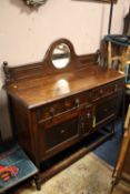 AN OAK BARLEYTWIST MIRROR BACKED SIDEBOARD
