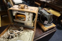 A CASED VINTAGE JONES SEWING MACHINE TOGETHER WITH A CRESTA EXAMPLE