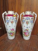 A PAIR OF TWIN HANDLED HAND PAINTED DRESDEN VASES