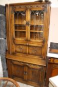 A MELLOWCRAFT QUALITY OAK CARVED AND GLAZED DISPLAY BOOKCASE H-194 CM W-135 CM