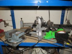 AN ENGINEERS VICE TOGETHER WITH A MITRE SAW BASE ETC