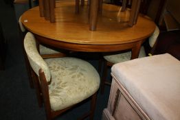 A VINTAGE TEAK EXTENDING DINING TABLE AND FOUR CHAIRS