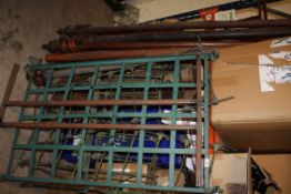 A GREEN ANTIQUE CAST METAL CRIB TOGETHER WITH A CURTAIN POLE