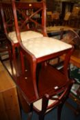 A MAHOGANY DROP LEAF DINING TABLE AND FOUR CHAIRS
